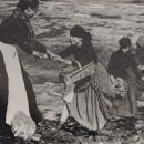 Image showing women, probably fish women, crossing the mud as they attempt to gather shellfish. The women in the foreground appears to be helping her workmate up the bank. Mentioned by Sir Cuthbert (6004547665)