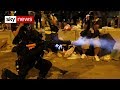 Hong Kong police rush at protesters